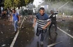 Hungary fires tear gas, water cannon at refugees