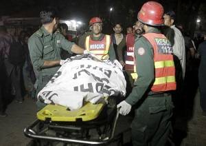 Pakistanis hunt for militants behind blast that killed at least 65