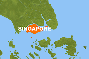 Collision off Singapore spills oil